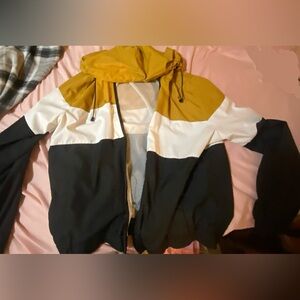 wind breaker . yellow white black.